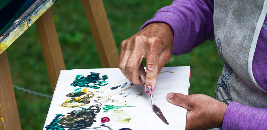 Older woman with dementia painting using art therapy