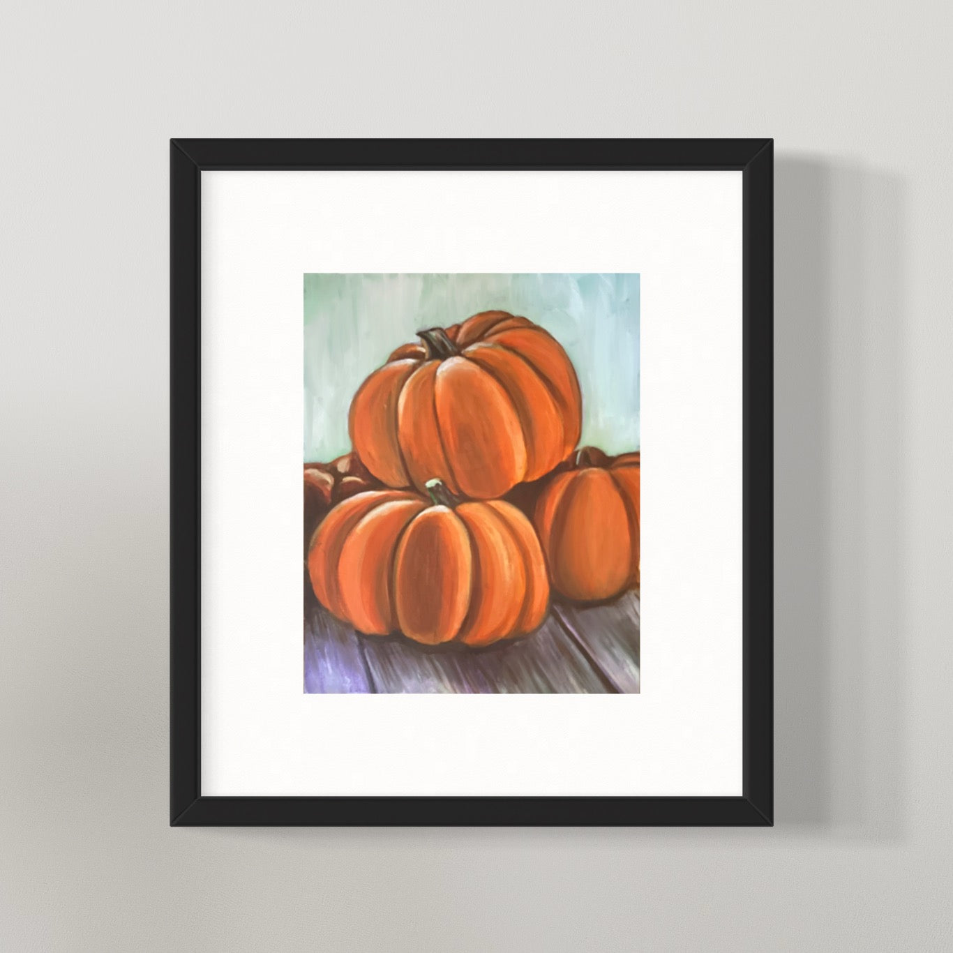 This is a framed picture of the pumpkins painting