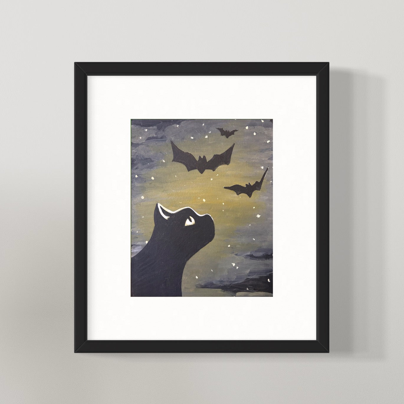 framed black cat and bat