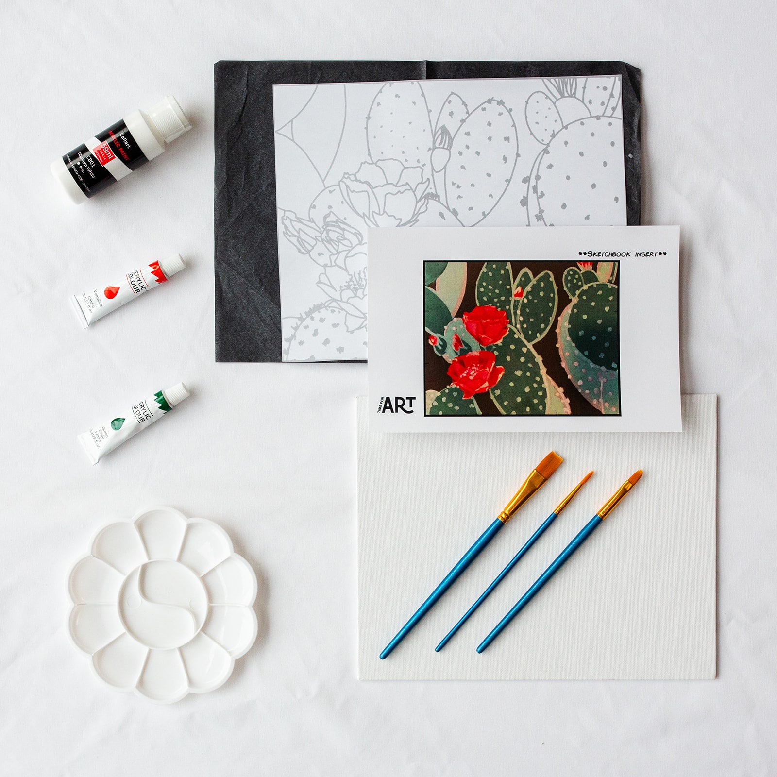 A picture of what is included in the Time For Art Flowering Christmas Cactus Painting Kit. The DIY Kit comes with 3 paints, a palette, the outline, brushes, canvas and more! 