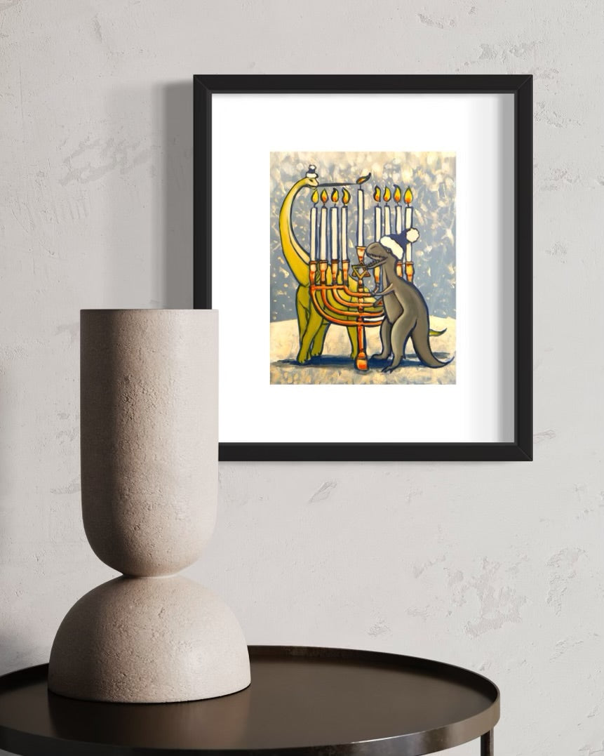 photo of framed Dinosaur Hanukkah Painting hung on wall with vase decoration on table in front of it