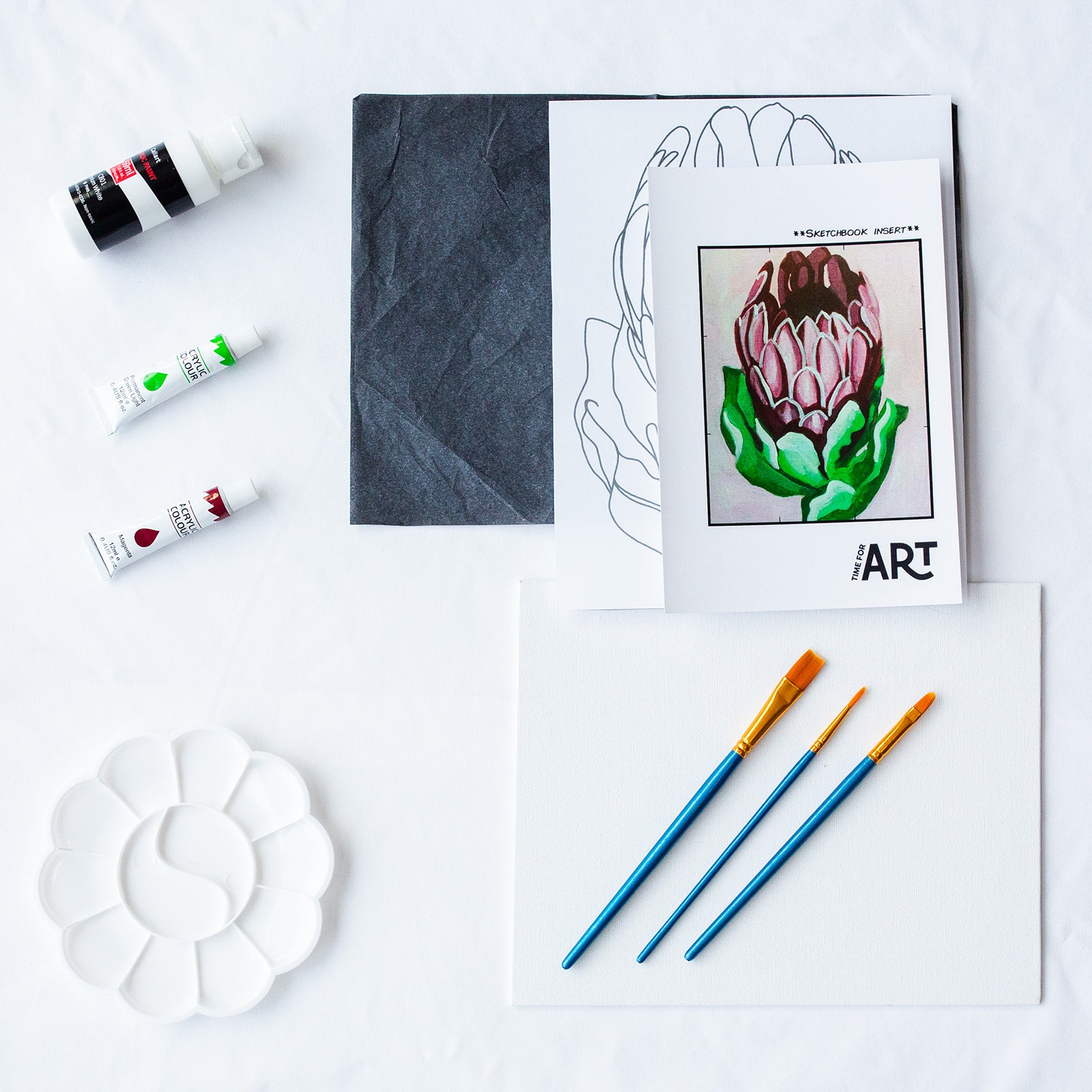 A picture of what is included in the Time For Art Protea Flower Painting Kit. The DIY Kit comes with 3 paints, a palette, the outline, brushes, canvas and more! 