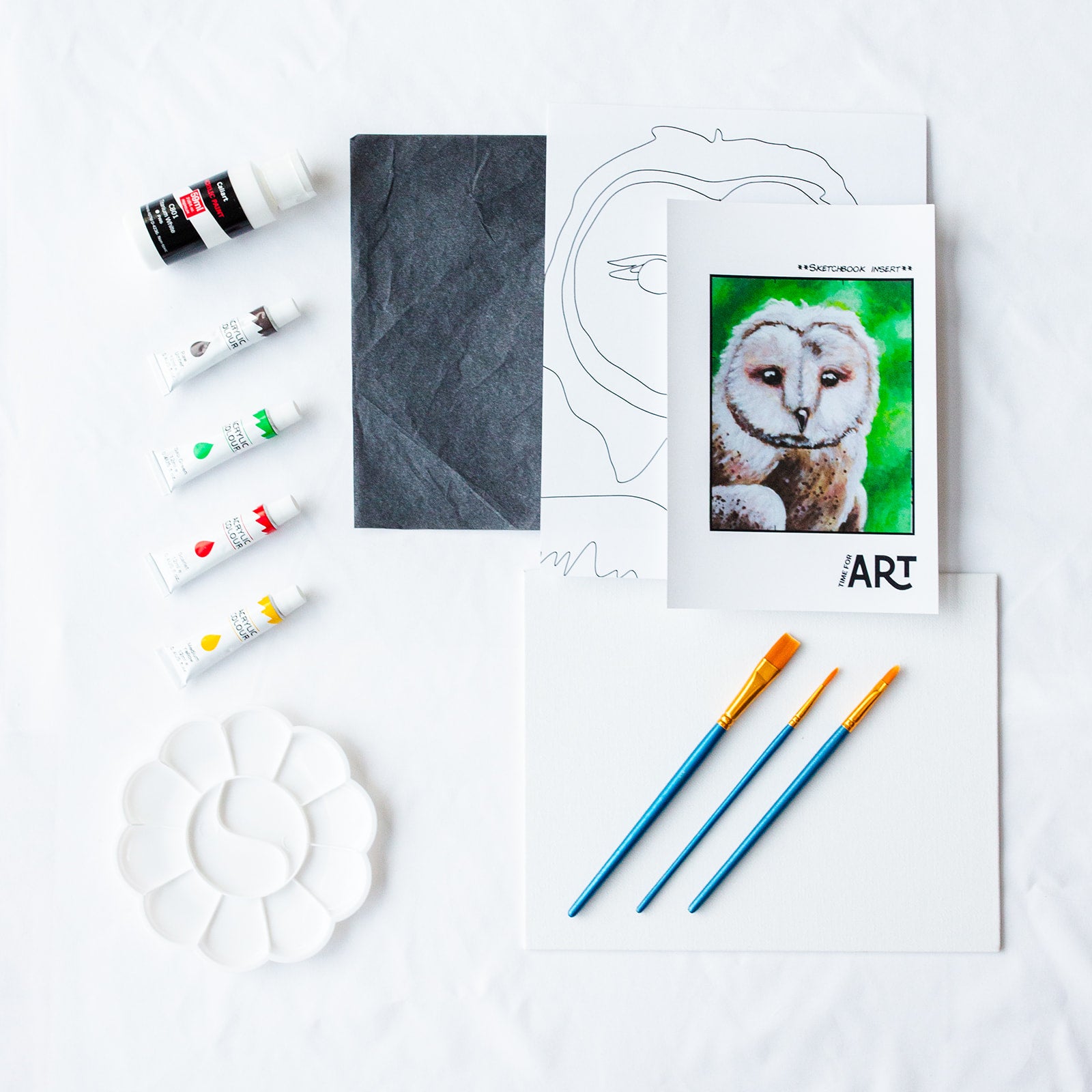 A picture of what is included in the Time For Sitting Owl Painting Kit. The DIY Kit comes with 5 paints, a palette, the outline, brushes, canvas and more! 
